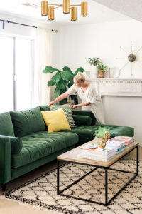 Green sofa in midcentury modern room