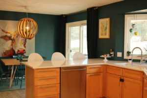 Green kitchen with white counters