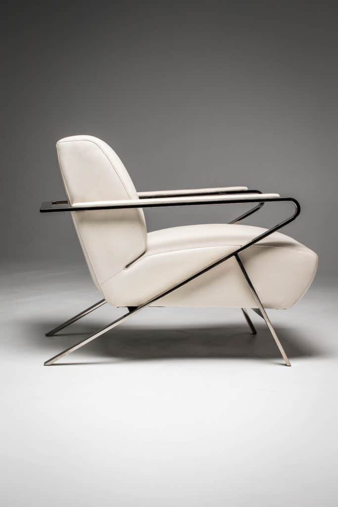 Elegant oscar chair in polished nickel and white leather